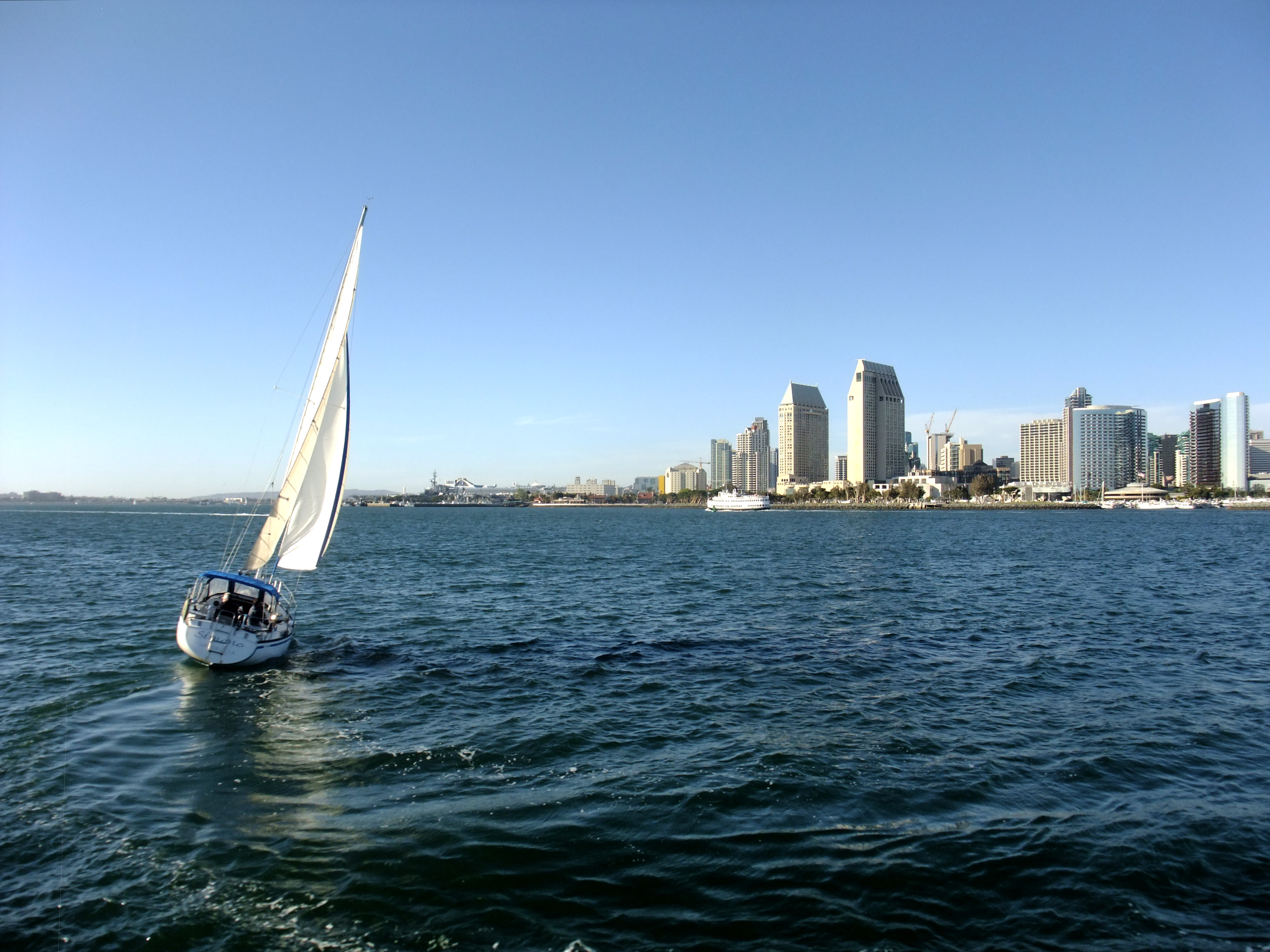 A sailboat sailing in the San Diego Bay